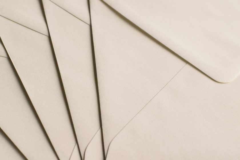 Envelope opened to show a patterned tissue lining