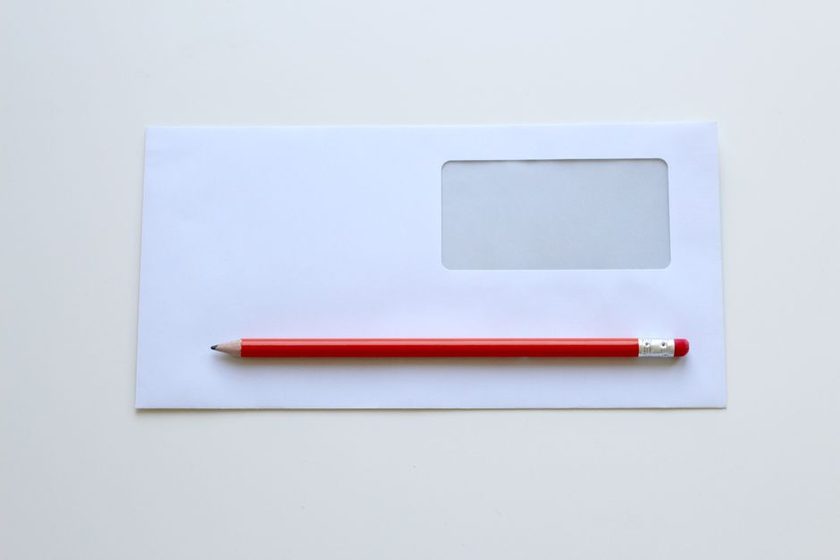 An open letter and a reply half-written beside it
